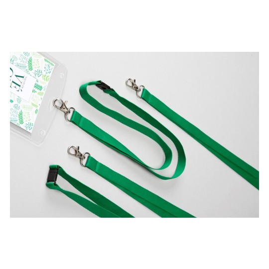 Nastro verde con un design a punti neri, con clip metalliche, presentato insieme a una busta trasparente con un'etichetta decorativa.