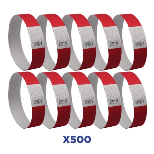 L'immagine mostra una serie di braccialetti identificativi, di colore rosso con una striscia bianca e numeri stampati. I braccialetti sono disposti in fila, con un totale di 500 pezzi visualizzati.
