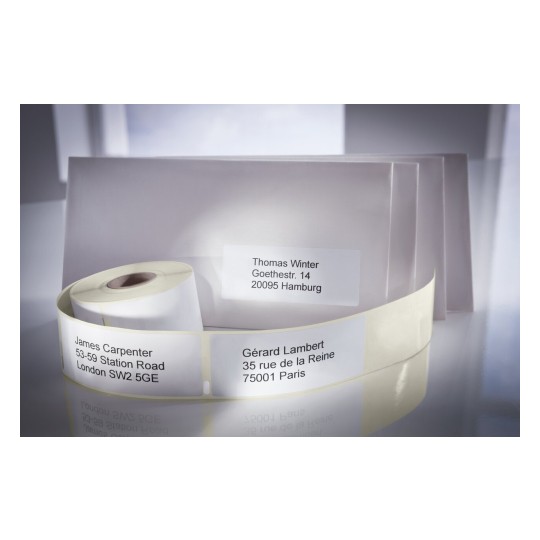 Labeled envelopes and a roll of address labels with names and addresses, including Thomas Winter in Hamburg and Gérard Lambert in Paris.