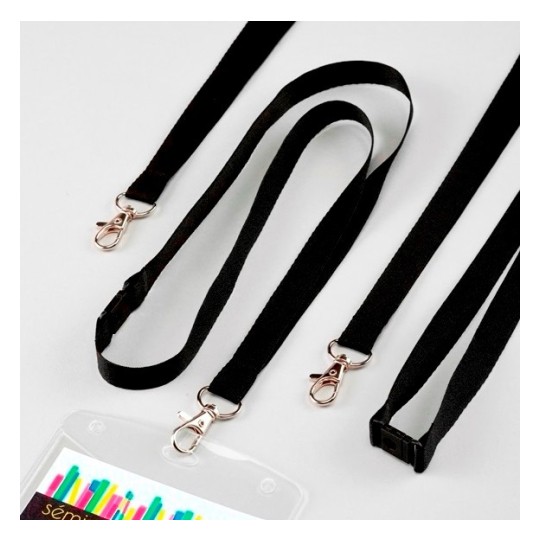 Lanyards in black with gold clips, laid out on a light surface. Includes one with a badge holder.
